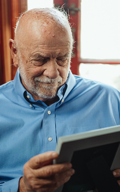 man looking at photo
