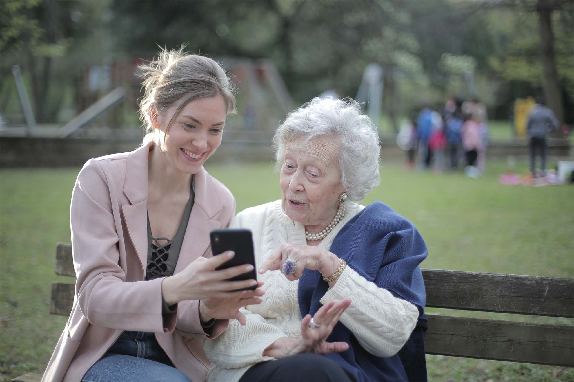 older woman and daughter on bench