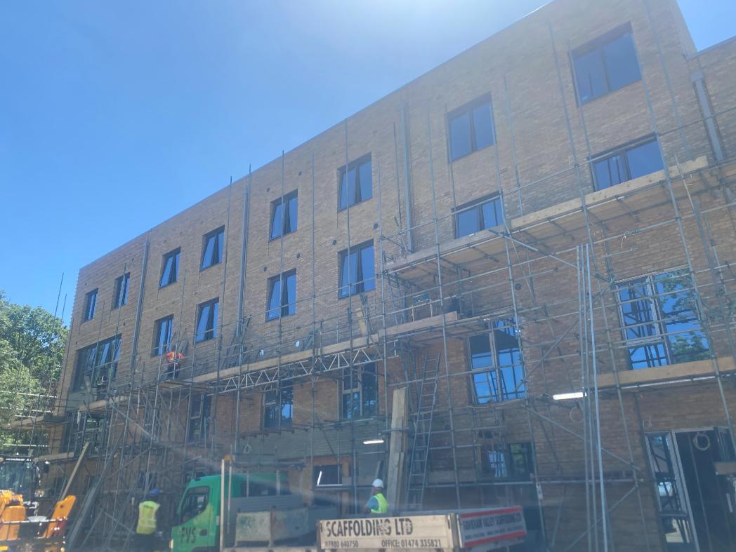 front of a building with scaffolding